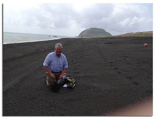 Gary collecting black coral sand